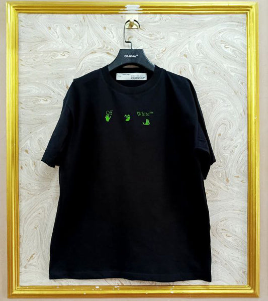 Black t-shirt with "Off-White™" logo on a hanger against a marble wall.