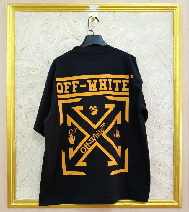 Black t-shirt with "Off-White™" design on a hanger against a decorative wall.