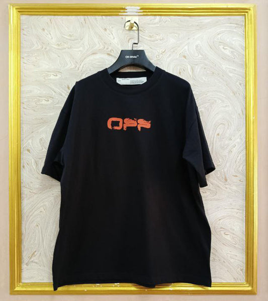 Black t-shirt with "Off-White™" logo on a hanger against a marble wall.