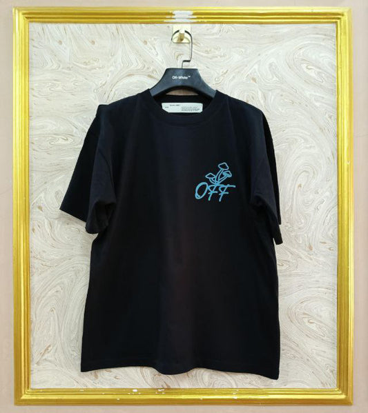 Black t-shirt with "Off-White™" logo on a hanger against a marble wall.