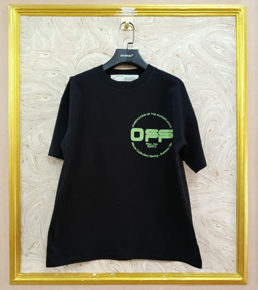 Black t-shirt with "Off-White™" logo on a hanger against a marble wall.