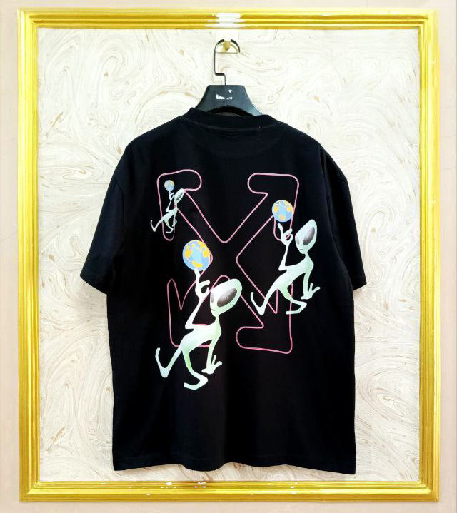Black t-shirt with "Off-White™" design on a hanger against a decorative wall.