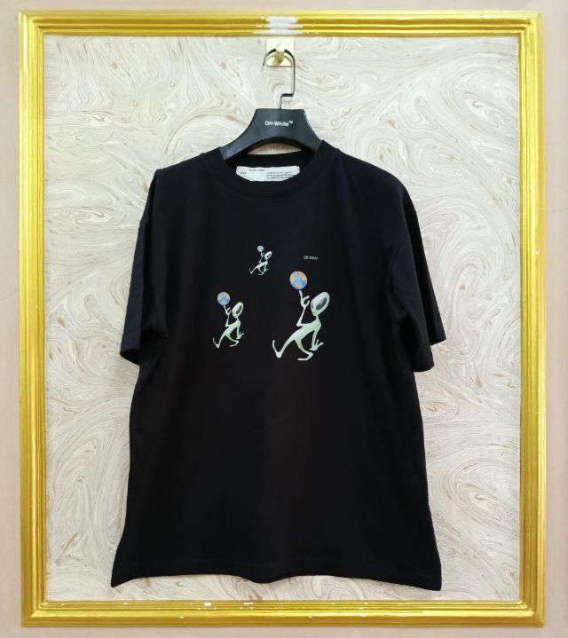 Black t-shirt with "Off-White™" logo on a hanger against a marble wall.