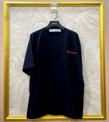 Black t-shirt with "Off-White™" logo on a hanger against a marble wall.