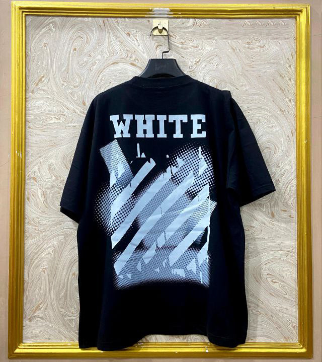 Black t-shirt with "Off-White™" design on a hanger against a decorative wall.