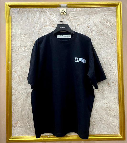Black t-shirt with "Off-White™" logo on a hanger against a marble wall.