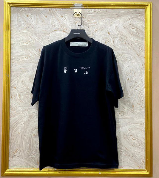 Black t-shirt with "Off-White™" logo on a hanger against a marble wall.