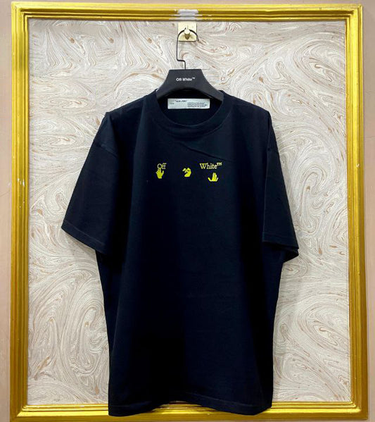 Black t-shirt with "Off-White™" logo on a hanger against a marble wall.