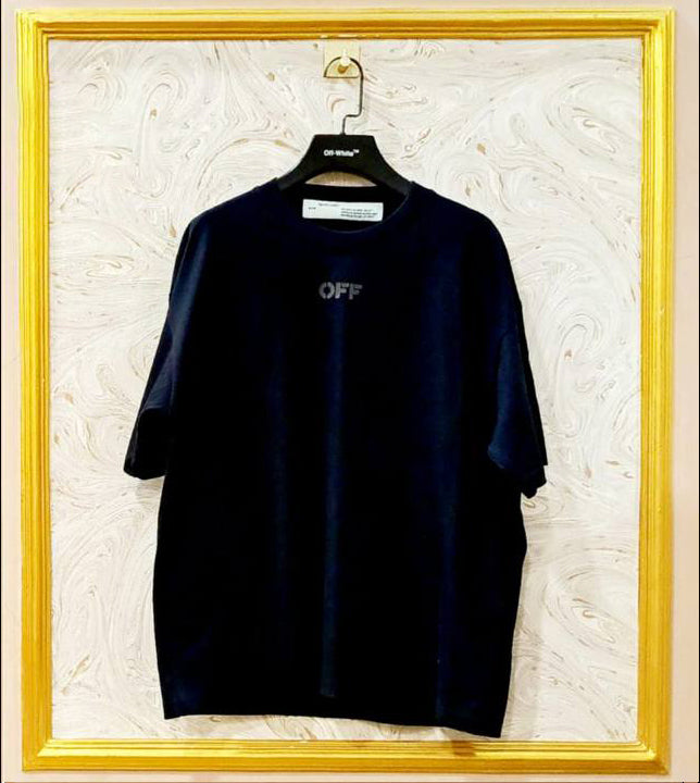 Black oversized t-shirt inspired by Off-White with “OFF” front logo, displayed on hanger in gold frame.