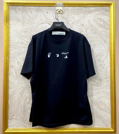 Black t-shirt with "Off-White™" logo on a hanger against a marble wall.