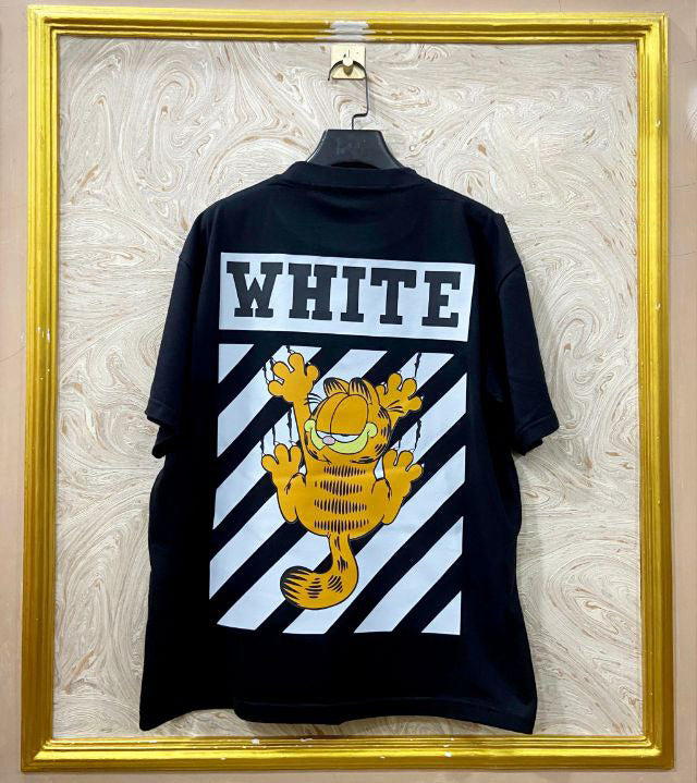 Black t-shirt with "Off-White™" design on a hanger against a decorative wall.