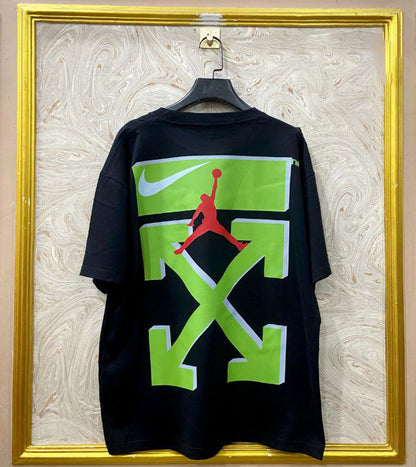 Black t-shirt with "Off-White™" design on a hanger against a decorative wall.