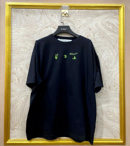 Black t-shirt with "Off-White™" logo on a hanger against a marble wall.