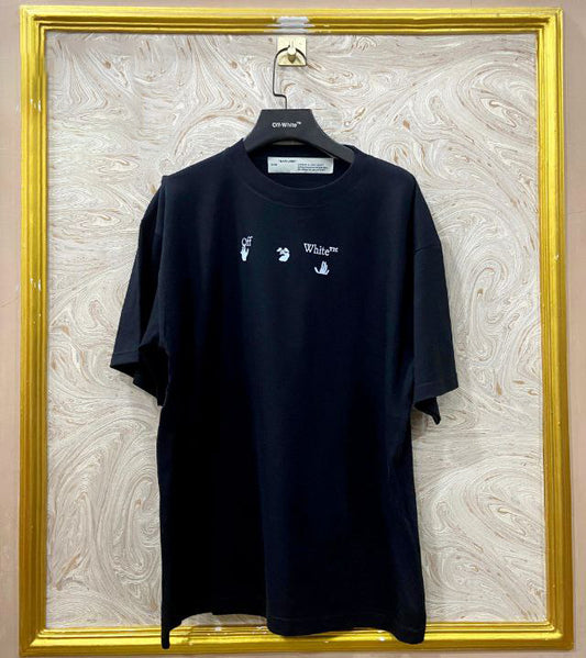 Black t-shirt with "Off-White™" logo on a hanger against a marble wall.
