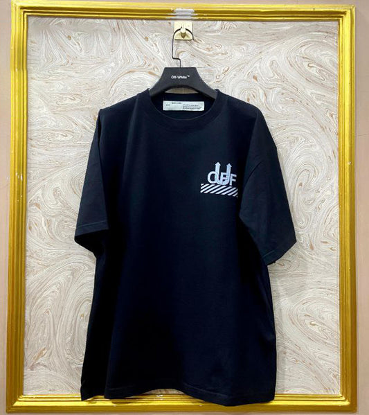 Black t-shirt with "Off-White™" logo on a hanger against a marble wall.