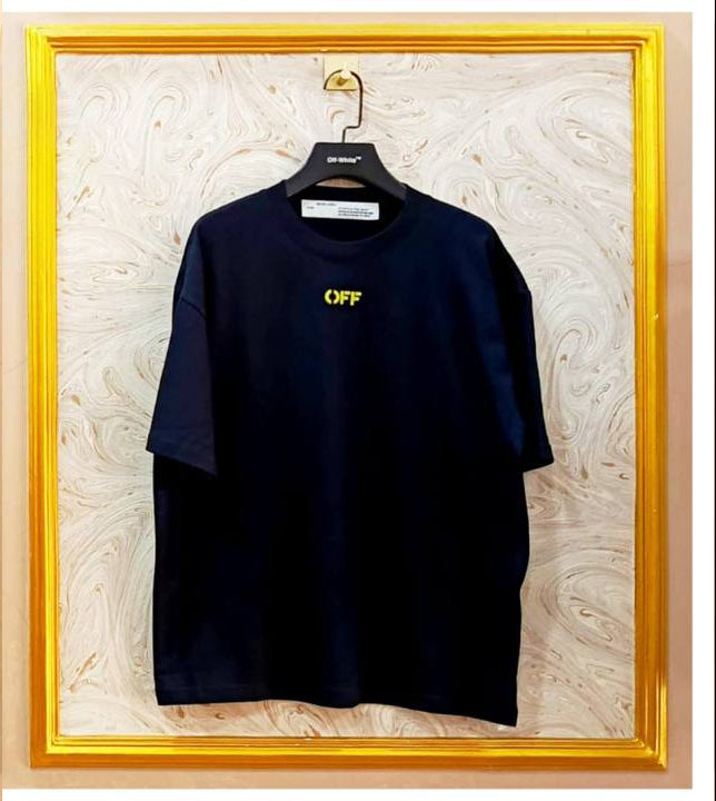 Black t-shirt with 'OFF' logo on a hanger against a decorative wall.