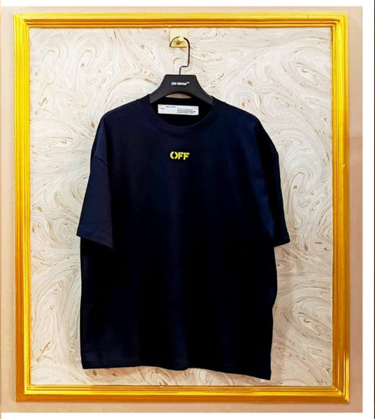 Black t-shirt with 'OFF' logo on a hanger against a decorative wall.