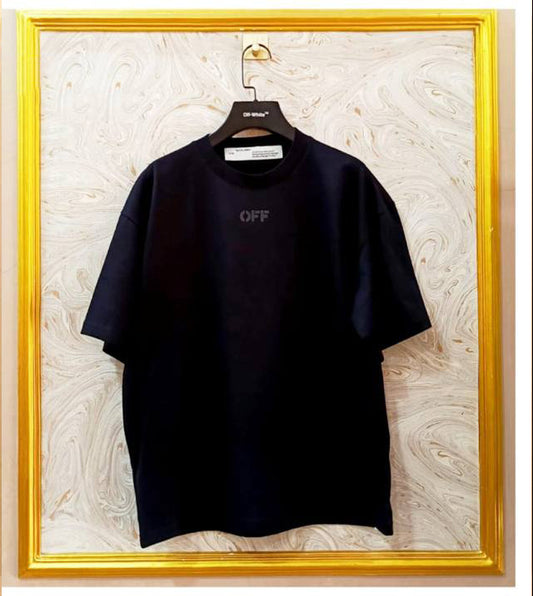 Black t-shirt with 'OFF' text on a hanger against a marble wall.