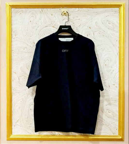 Black oversized t-shirt inspired by Off-White with “OFF” front logo, displayed on hanger in gold frame.
