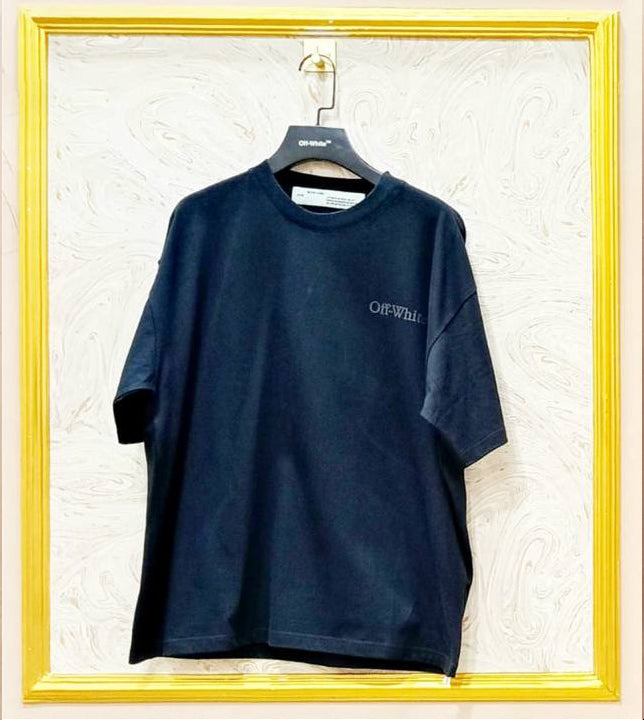 Black oversized t-shirt inspired by Off-White with “OFF” front logo, displayed on hanger in gold frame.