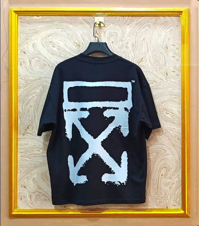 Black t-shirt with a light blue logo on a marble wall background
