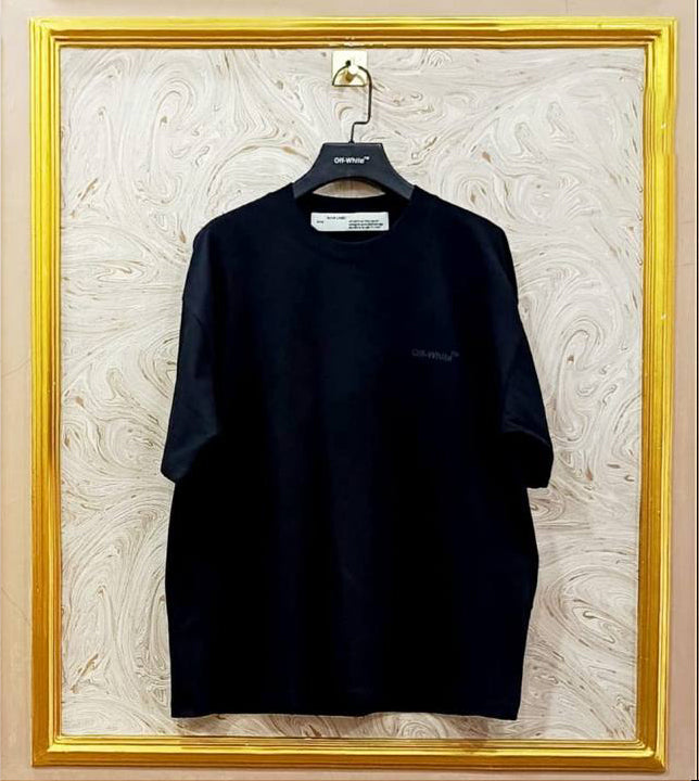 Black oversized t-shirt inspired by Off-White with “Off-White™” front logo, displayed on hanger in gold frame.