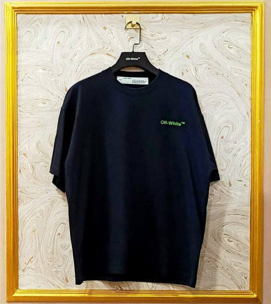 Black t-shirt with "Off-White™" logo on a hanger against a marble wall.