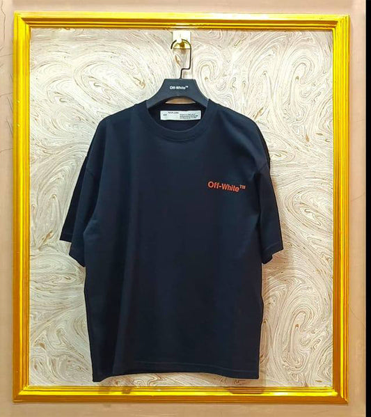 Black t-shirt with "Off-White™" logo on a hanger against a marble wall.