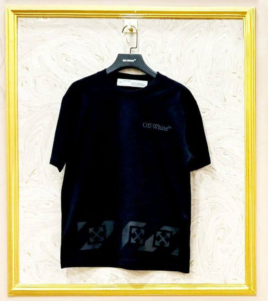 Black t-shirt with "Off-White™" logo on a hanger against a marble wall.