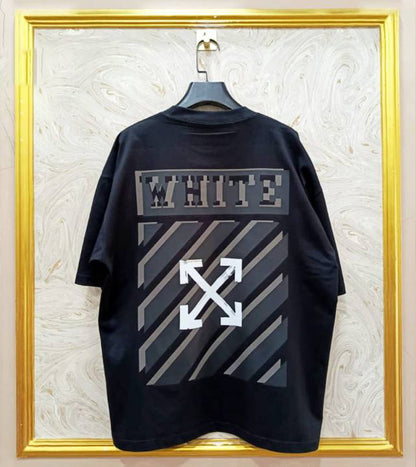 Black t-shirt with "Off-White™" design on a hanger against a decorative wall.
