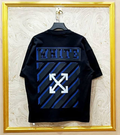 Black t-shirt with "Off-White™" design on a hanger against a decorative wall.