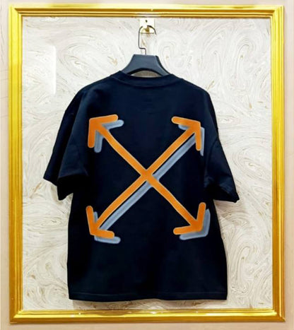 Black t-shirt with "Off-White™" design on a hanger against a decorative wall.