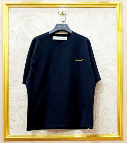 Black t-shirt with "Off-White™" logo on a hanger against a marble wall.