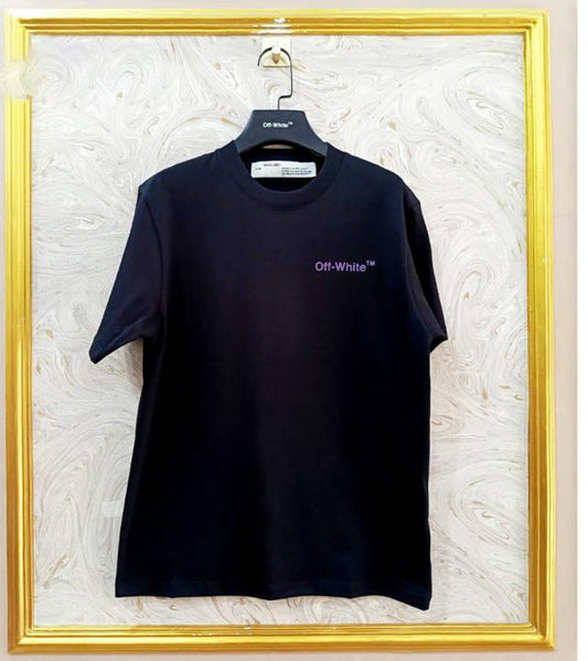 Black t-shirt with "Off-White™" logo on a hanger against a marble wall.