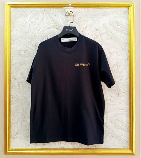 Black t-shirt with "Off-White™" logo on a hanger against a marble wall.