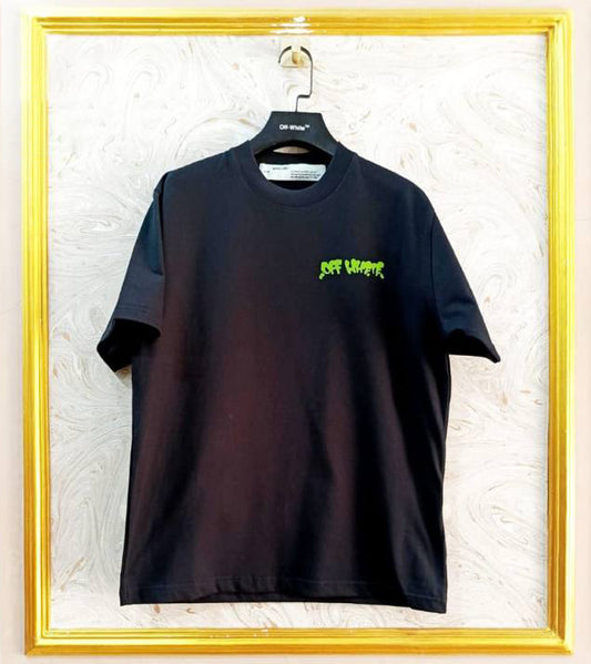 Black t-shirt with "Off-White™" logo on a hanger against a marble wall.