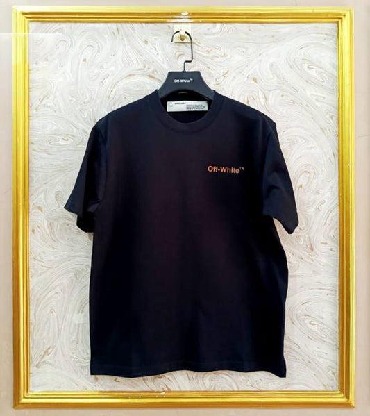 Black t-shirt with "Off-White™" logo on a hanger against a marble wall.