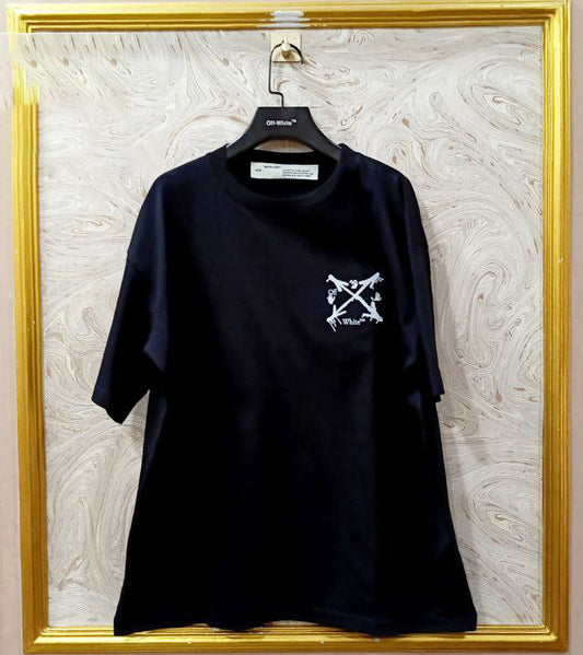 Black t-shirt with "Off-White™" logo on a hanger against a marble wall.