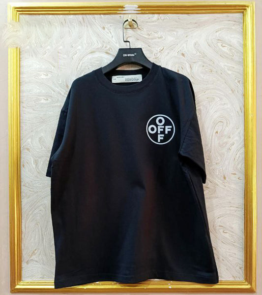 Black t-shirt with "Off-White™" logo on a hanger against a marble wall.